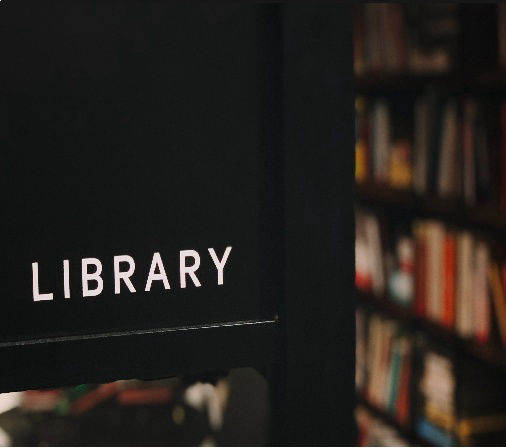 Picture of library shelves and title "Library"